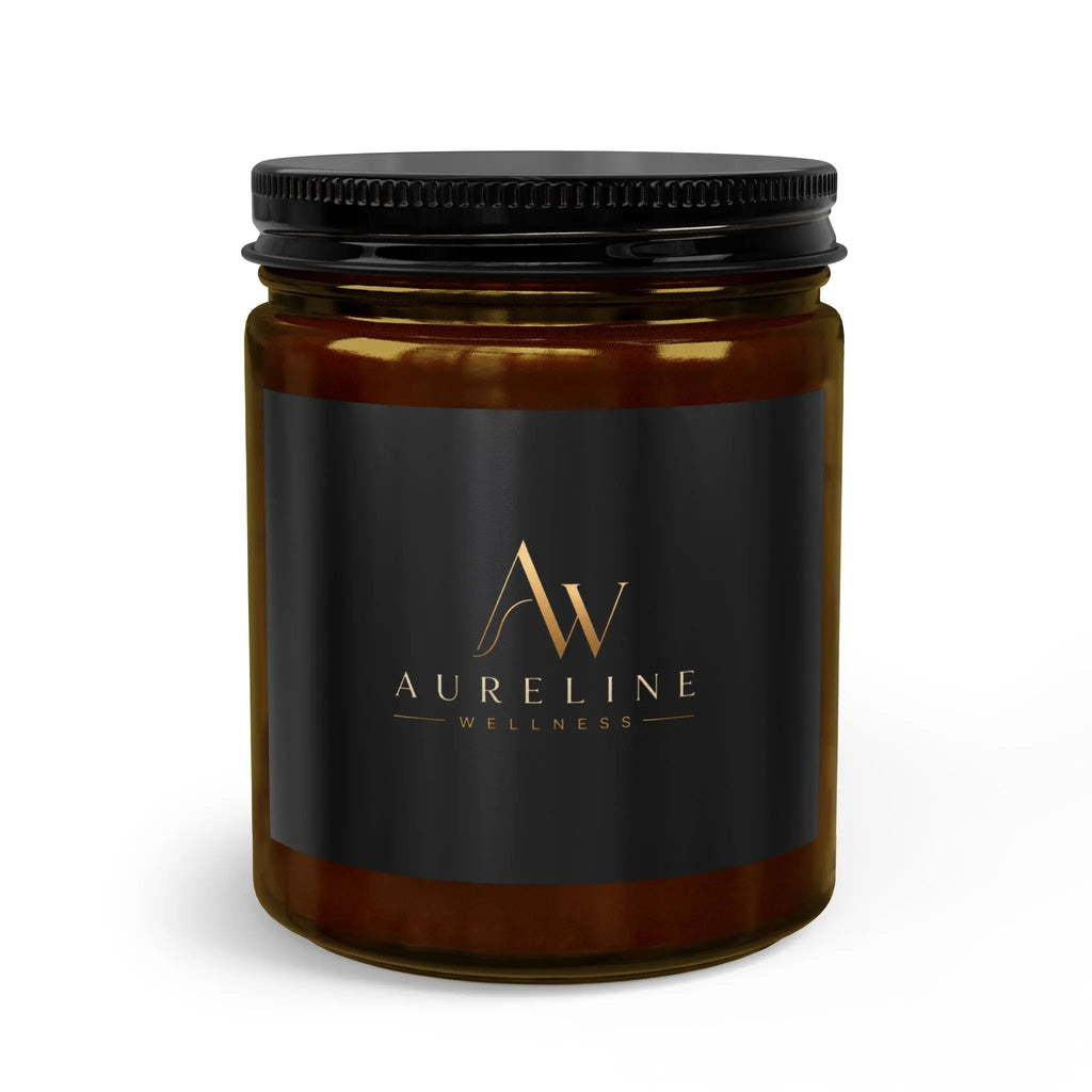 Amber glass Aureline Wellness mason jar candle with black lid and gold-lettered label.