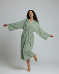Woman wearing green Turkish cotton waffle spa robe