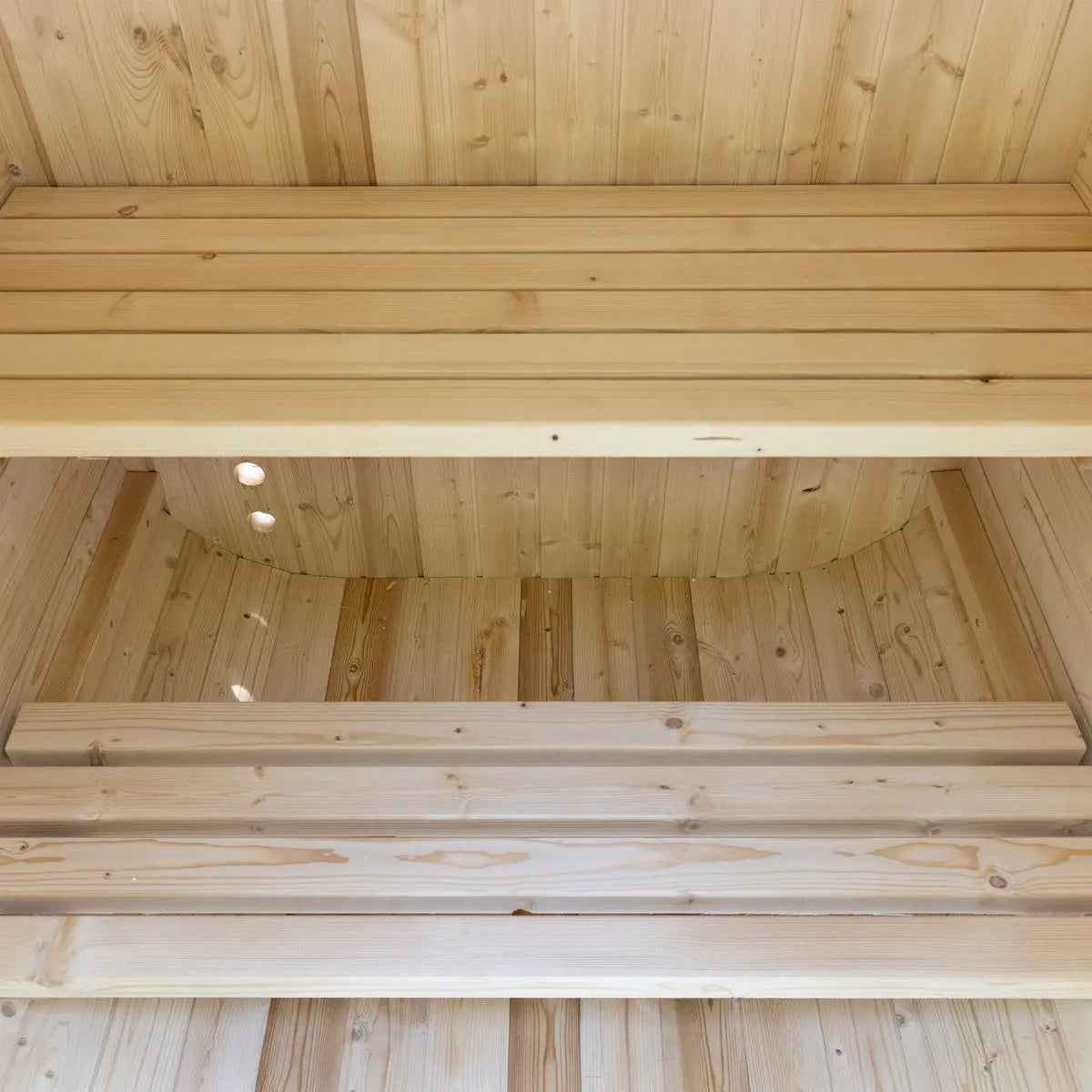 Auris One luxury outdoor cedar sauna interior with spacious bench seating and natural wood craftsmanship
