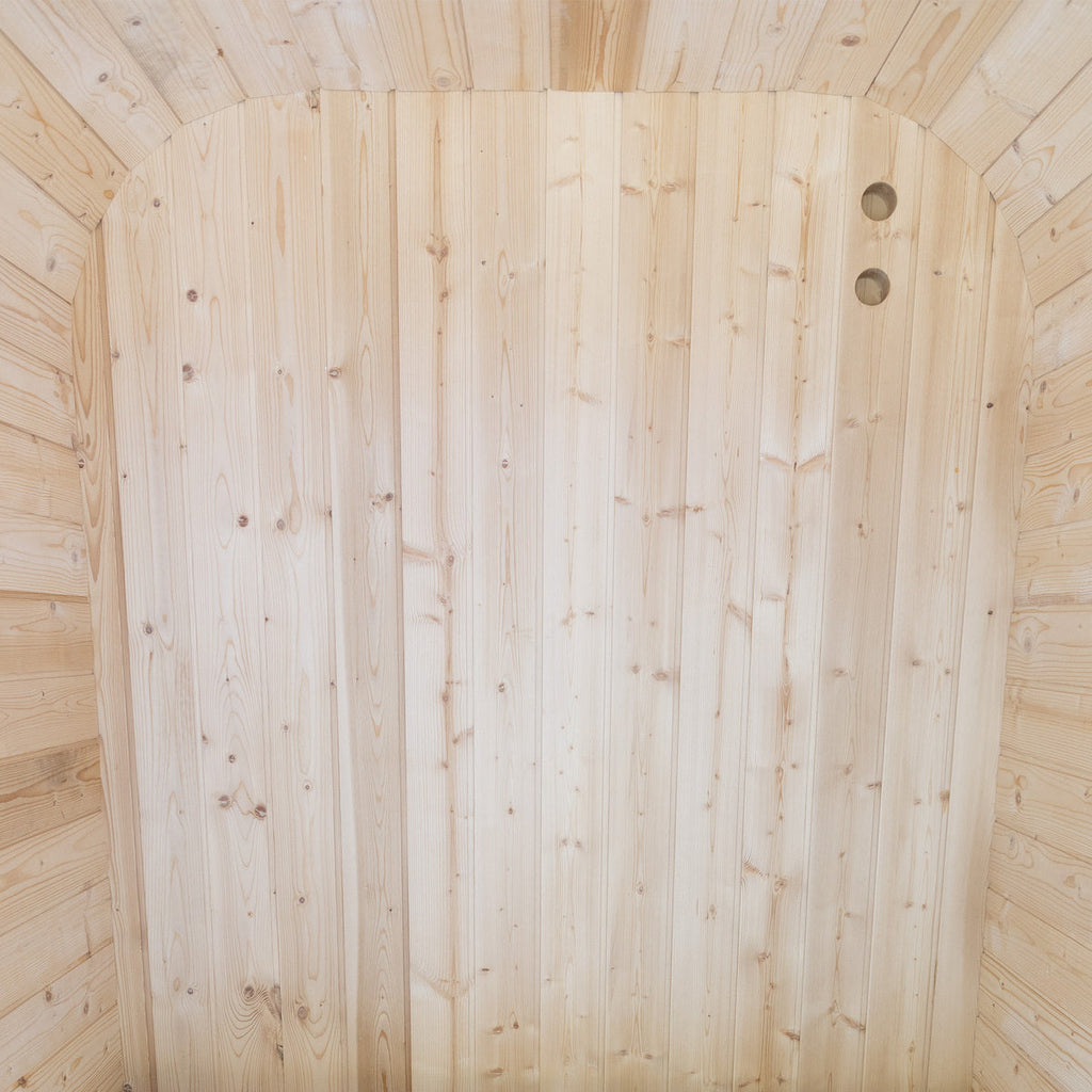 Natural cedar wood interior detail inside a luxury outdoor sauna