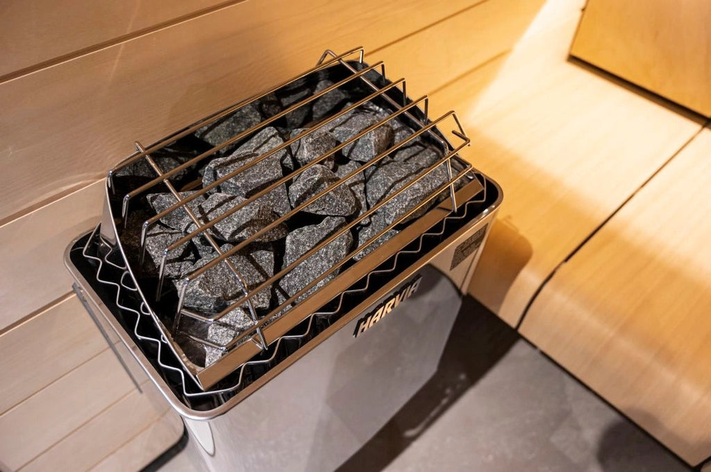 Sauna heater with natural stones inside a luxury cedar sauna close up