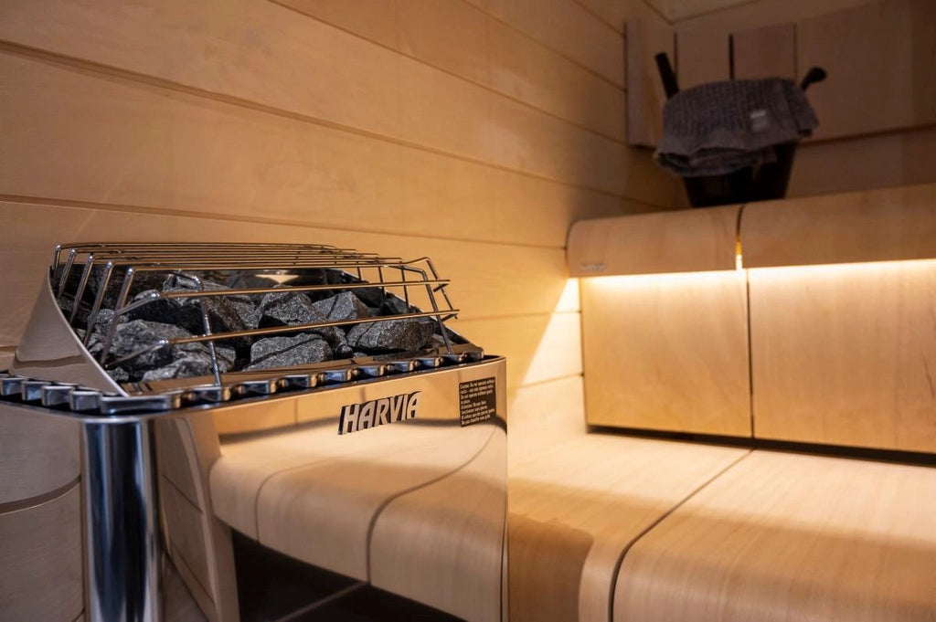 Sauna heater with natural stones inside a luxury cedar sauna
