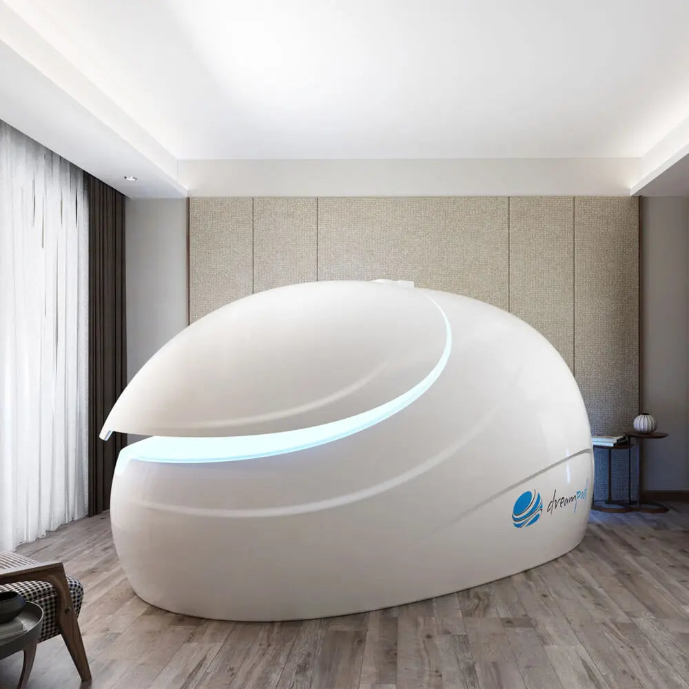 Dreampod Sport flotation pod installed in a modern bedroom wellness space, shown from the front left side