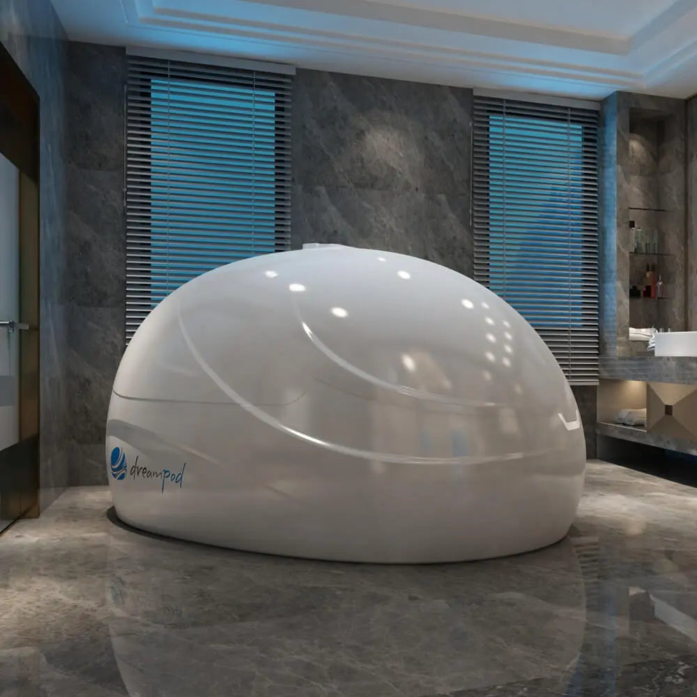 Dreampod Sport flotation pod installed in a modern bathroom wellness space, shown from the front right side