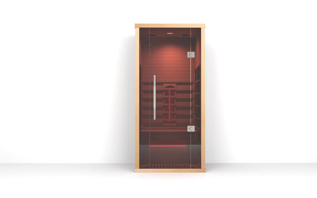 Full front view of the Lumin One infrared sauna with glass door, Canadian hemlock wood frame, and illuminated red infrared heating interior on a white background.