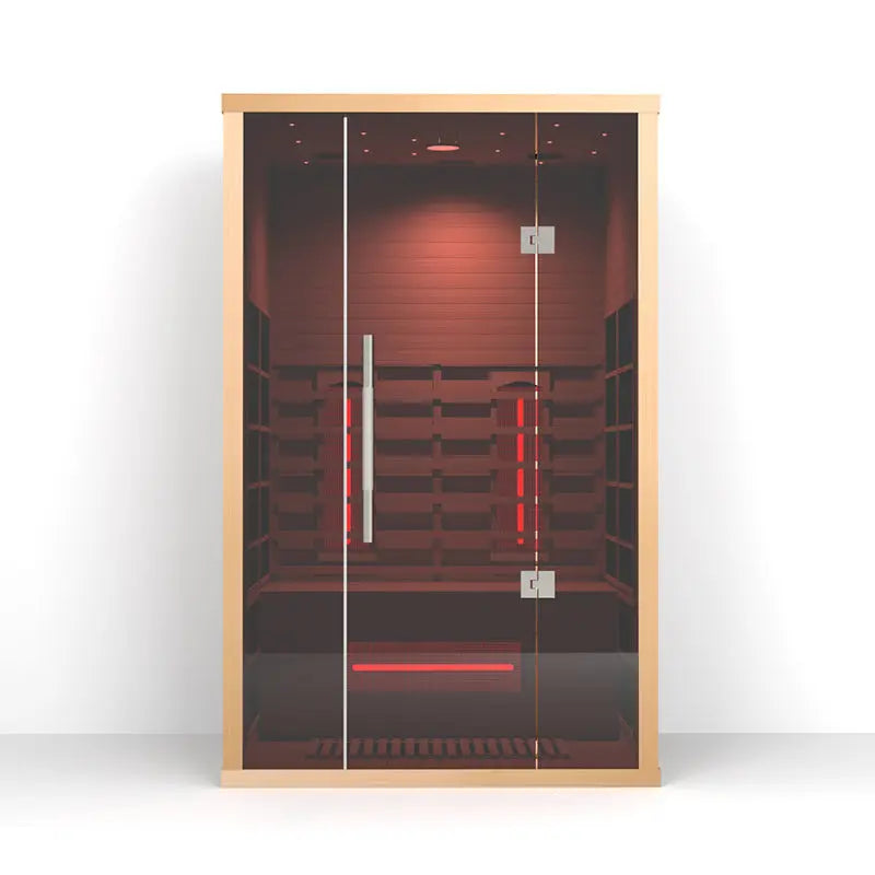 The Orivon Lumin Two infrared sauna in Canadian hemlock with red-lit interior and full-length glass door.