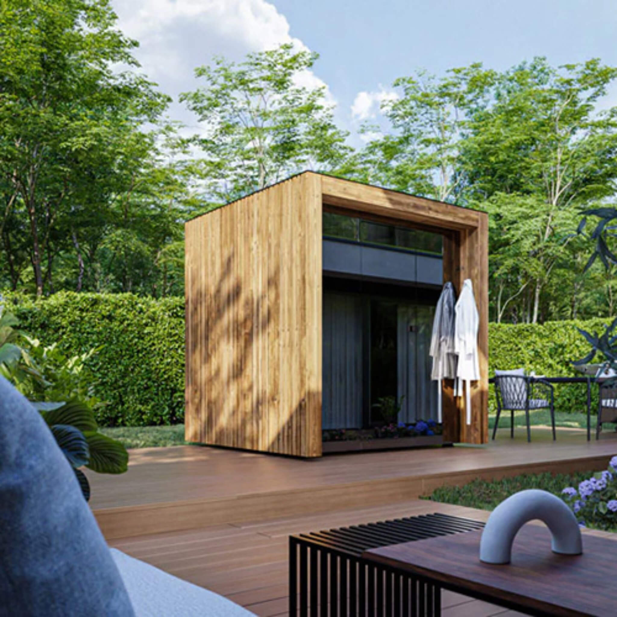 ThermaSol Fortis outdoor glass-front sauna cabin in a garden setting